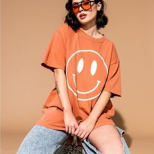 Dressed in Lala The World Needs Your Magic in sunset orange